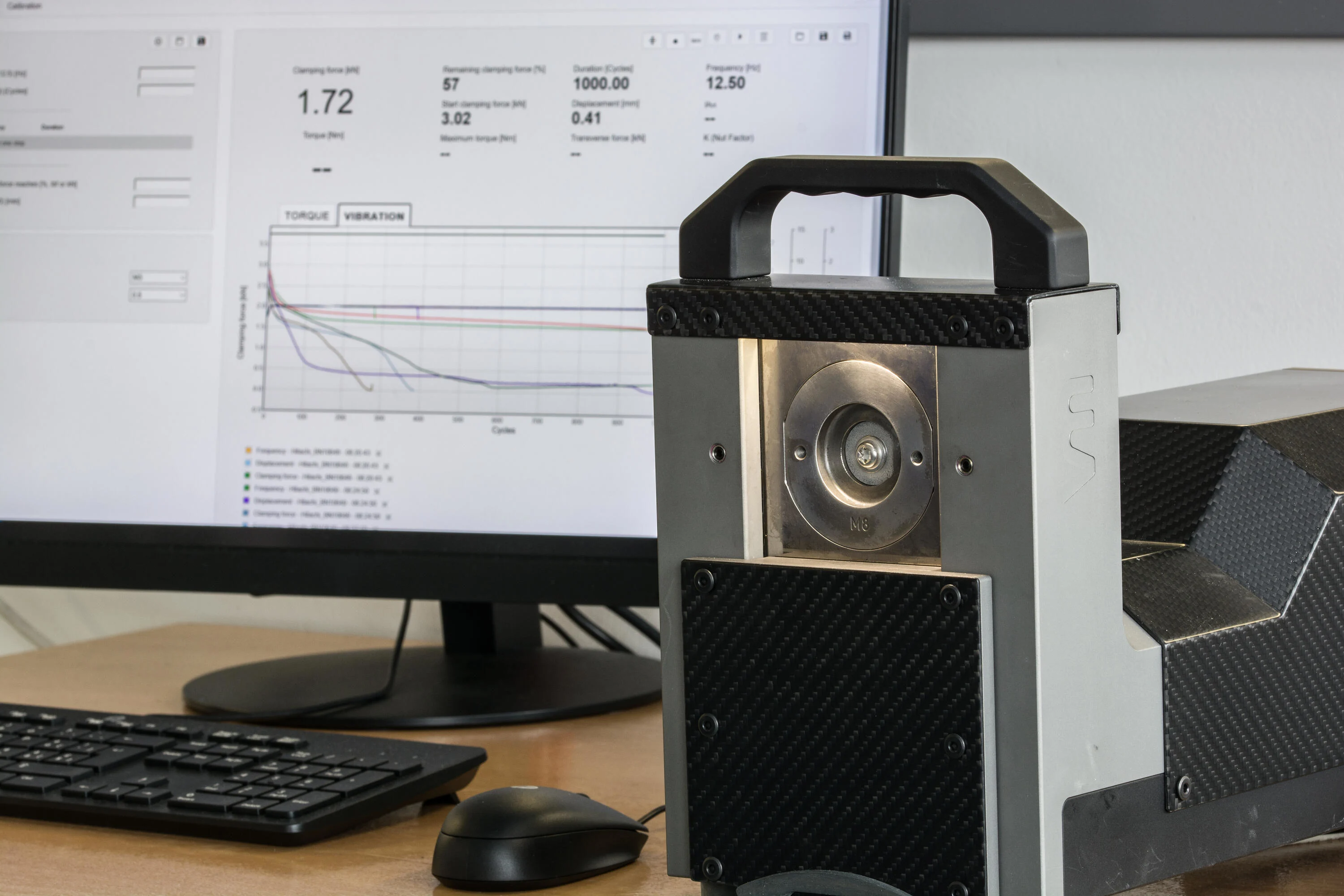 Junker vibration testing equipment with testing machine and results screen.