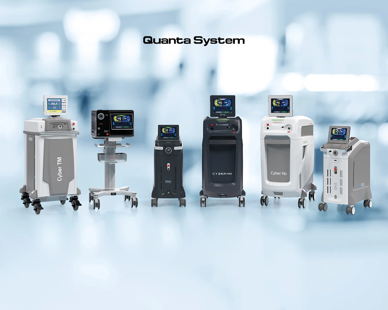 Sei macchine laser mediche su ruote con schermi, etichettate "Quanta System," su uno sfondo blu sfocato.