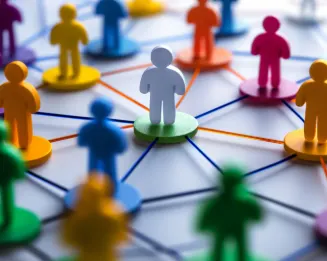 Different colors of human figures connected with each other