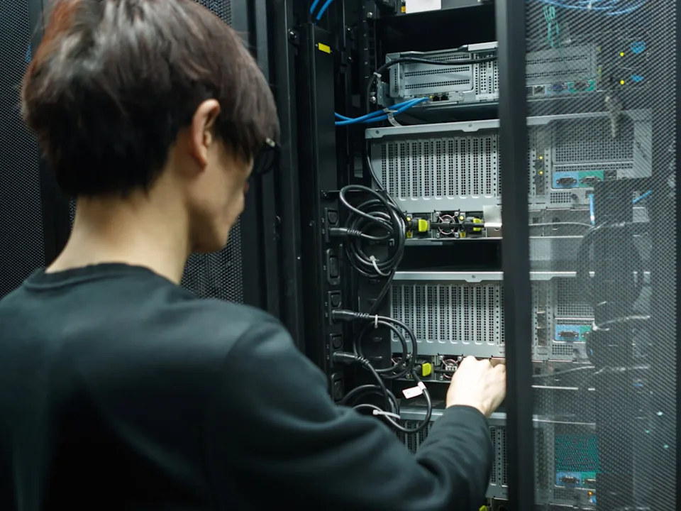 A man working with high performance data center computer