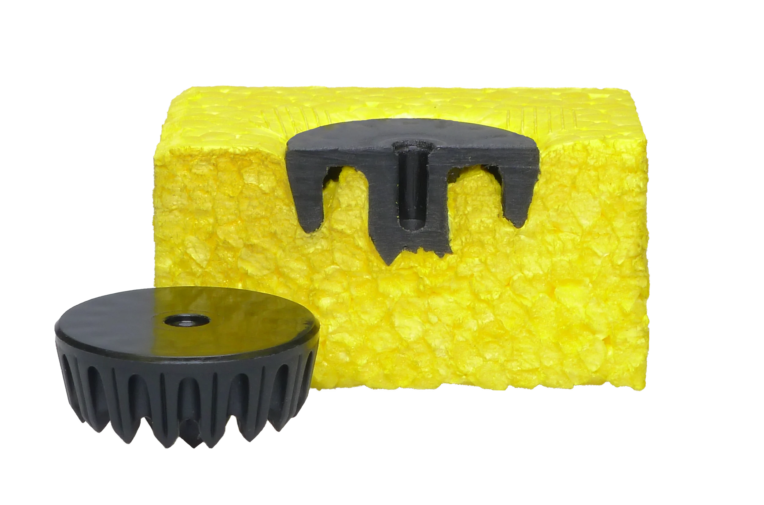 A MultiMaterial-Welding LiteWWeight zEPP fastener in front of a cut out of an installed fastener in yellow styrofoam