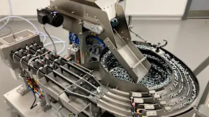 Close-up of the hopper, autofeed system and feeder tracks of the PEMSERTER IN-DIE NextGen Universal Feed Cart.