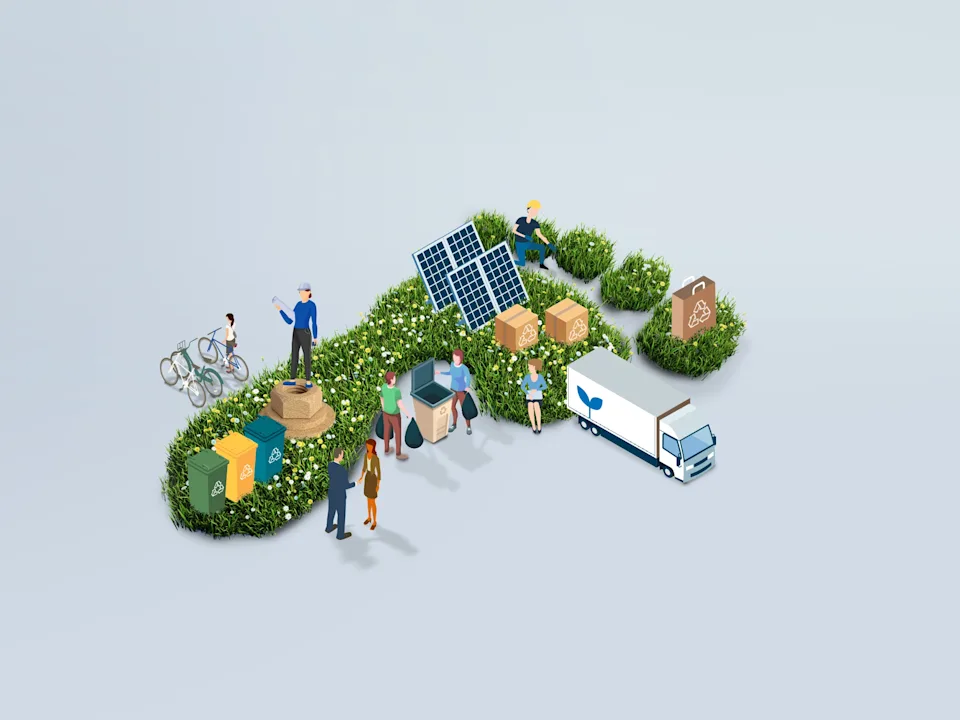 A group of people standing in a green space that has the shape of a footprint