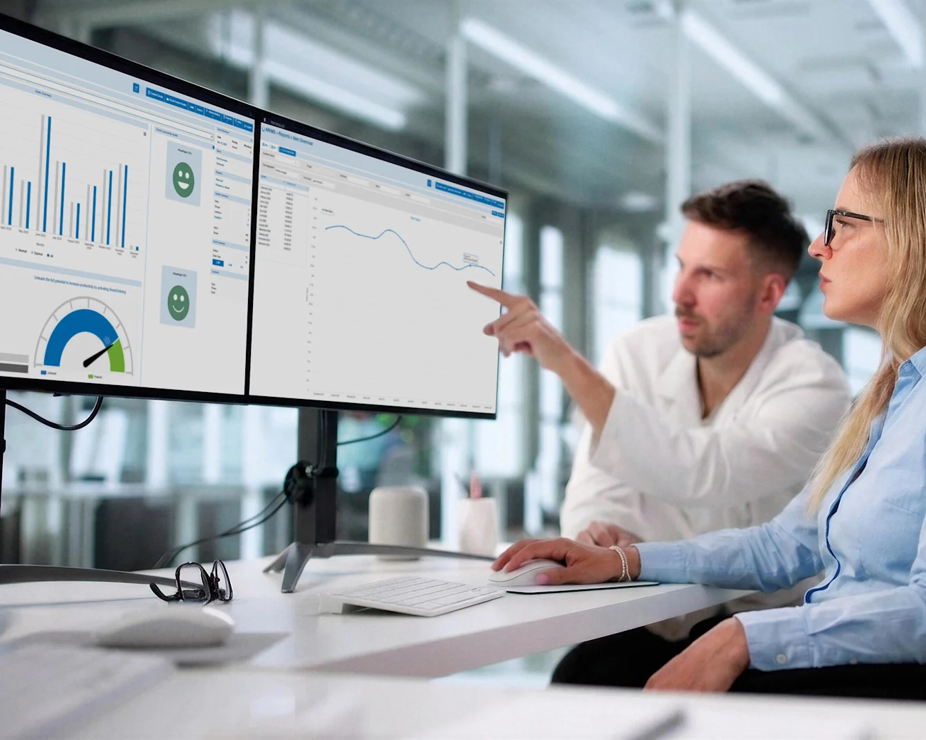 People discussing material flow report on screen