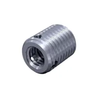 Silver FASTEKS metal threaded insert with three sharp cutting holes on a white background.