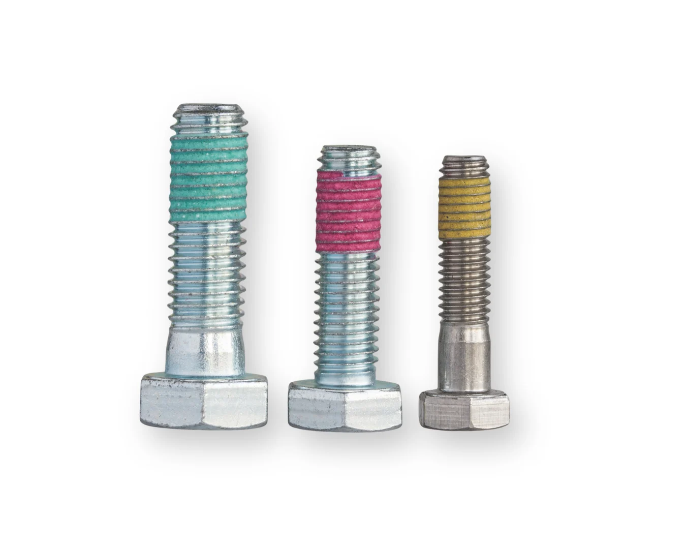 Three bolt with differently colored Precote coatings: a turquoise Precote 85, a red Precote 80 and a yellow Precote 30.