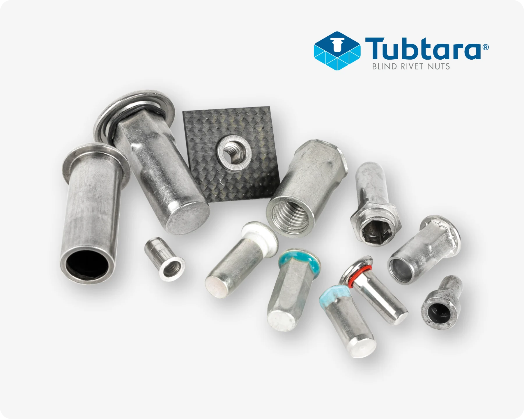 An ensemble of different Tubtara blind rivet nuts, including open and closed-end rivet nuts, and blind rivet nuts with underhead seal.