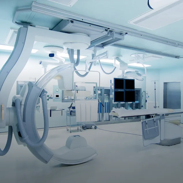 Complicated medical devices in a room.