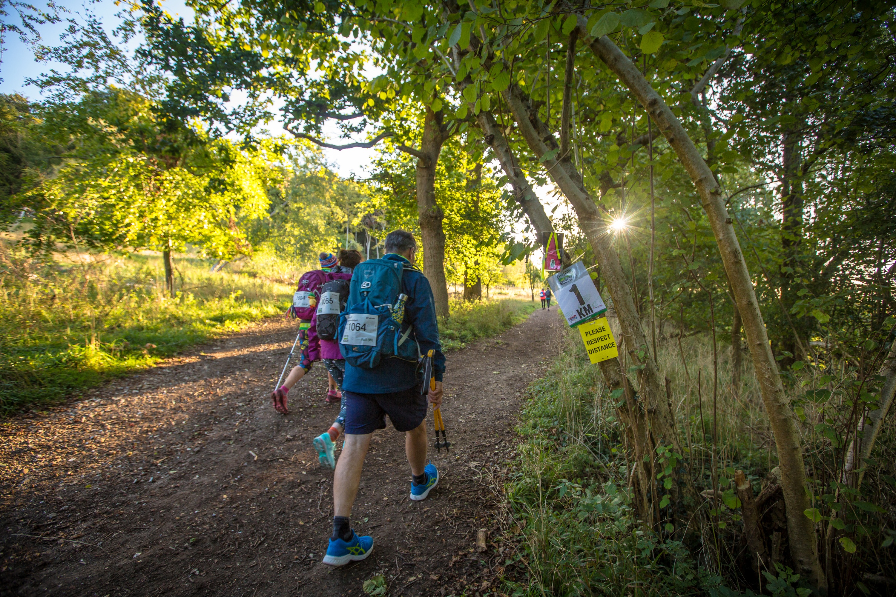 A small group of people reaching the 1KM point of the Chiltern 50 Ultra Challenge.