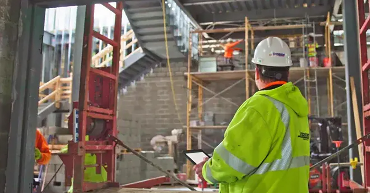 Screenshot from USA TODAY's Innovation Leaders documentary showing a construction professional using Fieldwire on a tablet to access project information on an active jobsite.