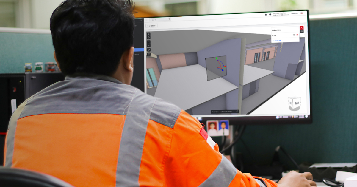 Construction worker viewing a 3D model on a computer using the 'Cut Sections' feature in Fieldwire's jobsite management software.