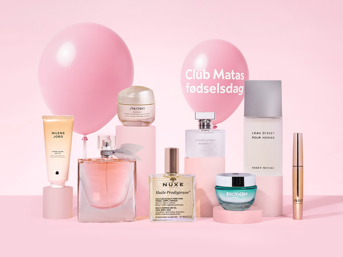 Et udvalg af skønhedsprodukter og parfumer fra mærker som Shiseido og Nuxe, med lyserøde balloner og teksten 'Club Matas fødselsdag'.