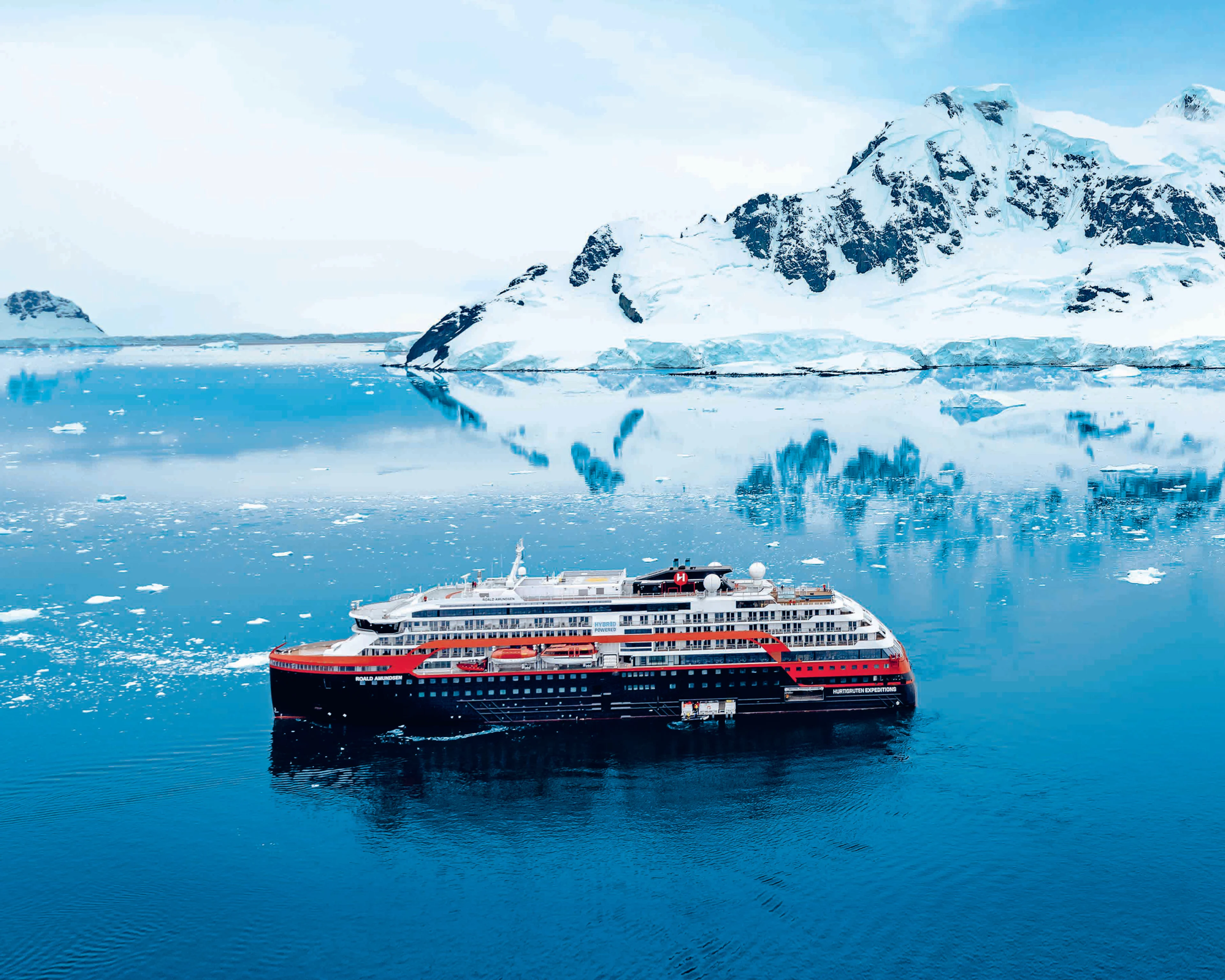 MS Roald Amundsen anchoured amongst the ice in Antarctica. Photo Credit: HX Hurtigruten Expeditions.