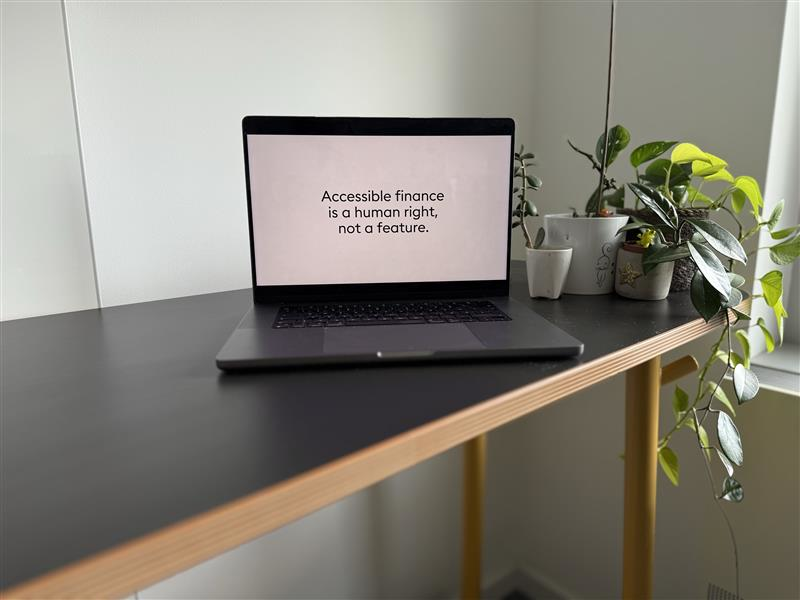a laptop screen showing "accessible finance is a human right, not a feature."