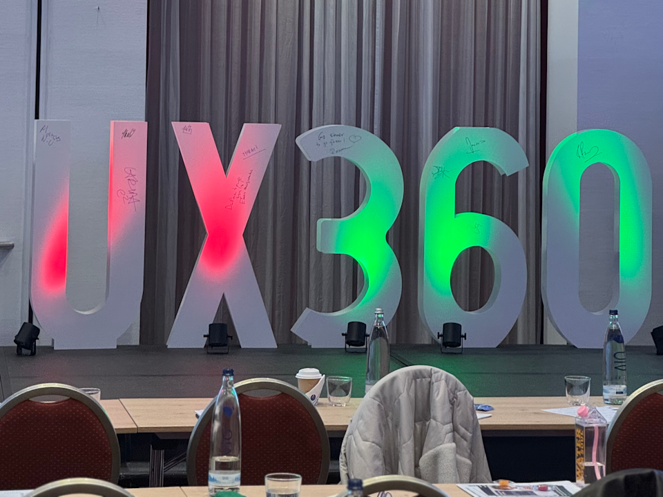 the letters UX 360 standing on a stage