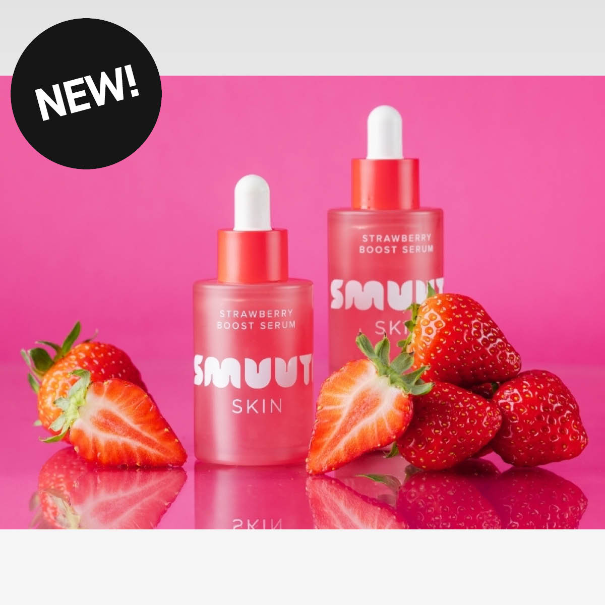 To rosa flasker med SMUUTI SKIN-serum, omgitt av jordbær, og merket "NEW!".
