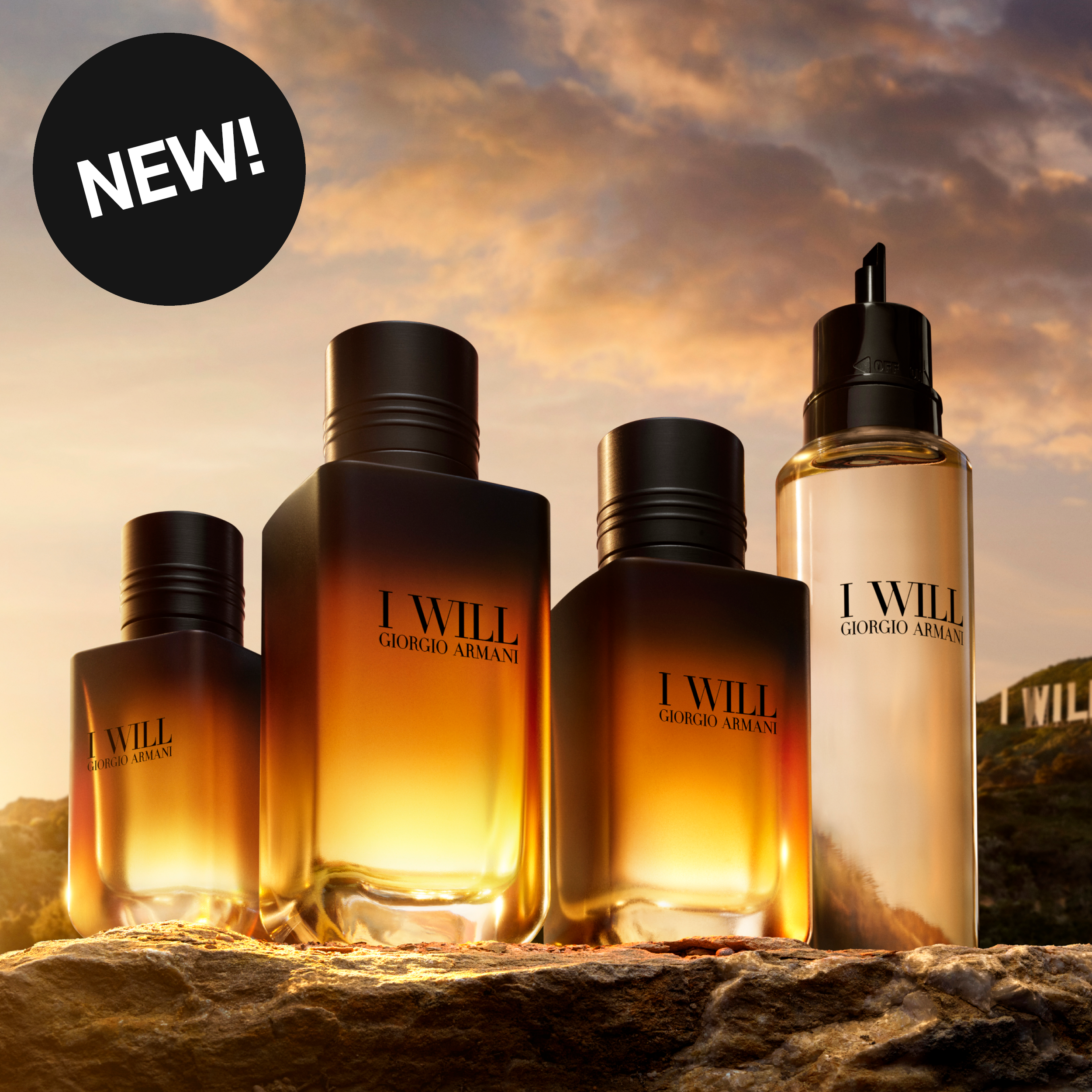 Giorgio Armani I Will-doftprodukter i varmt solnedgångsljus. Bilden innehåller texten ”New!”.