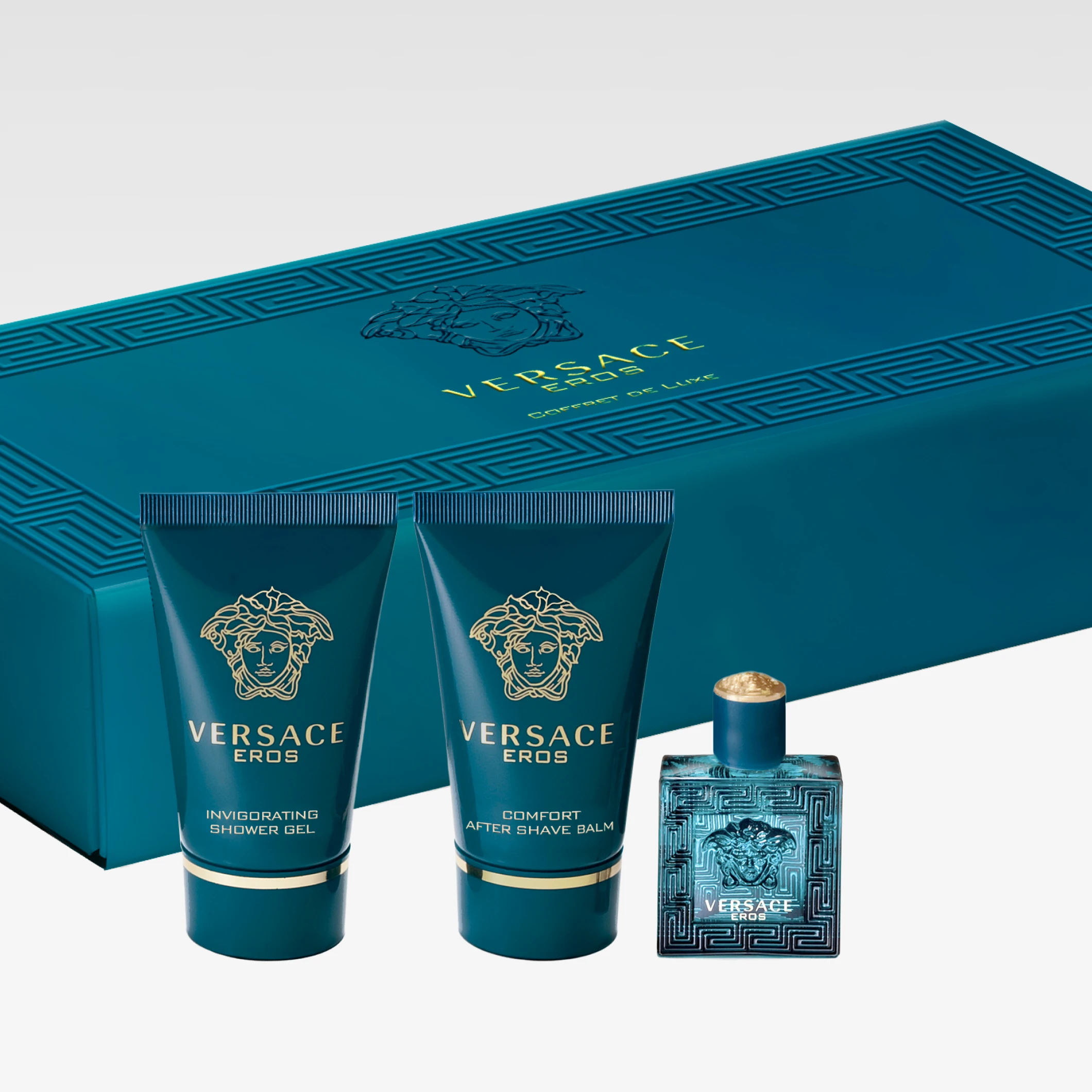 Versace Eros -lahjapakkaus turkoosissa rasiassa tekstillä “VERSACE EROS”, mukana Invigorating Shower Gel, Comfort After Shave Balm ja hajuvesipullo.