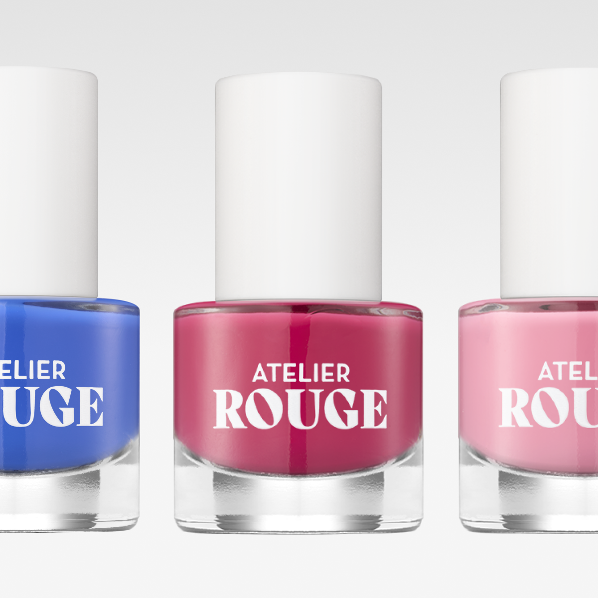 Atelier Rouge nagellack i tre färger: blå, röd och rosa.