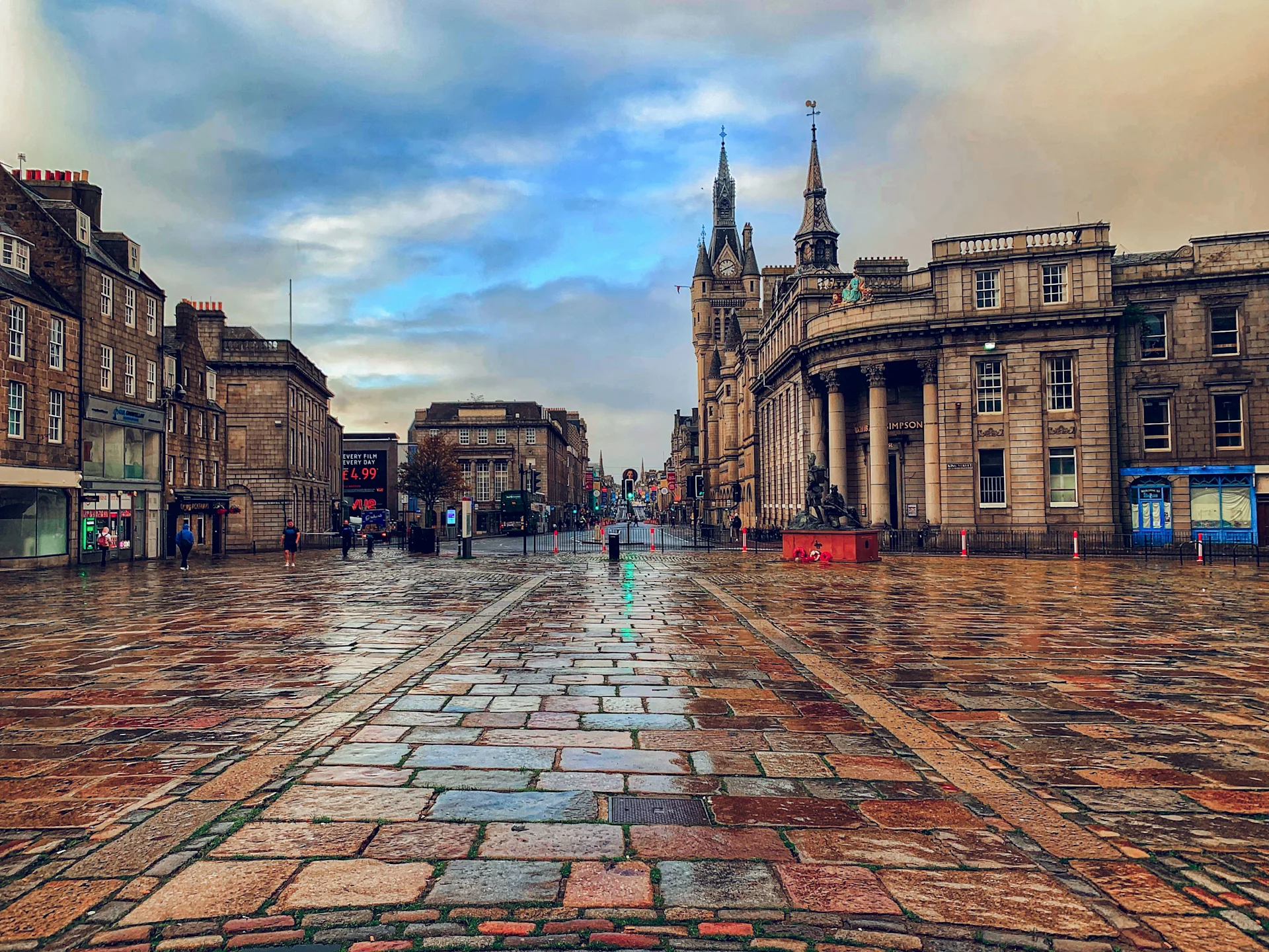 A view of Aberdeen's historic city centre, with its distinctive granite architecture and open plaza, showcasing the character of Scotland's "Granite City."