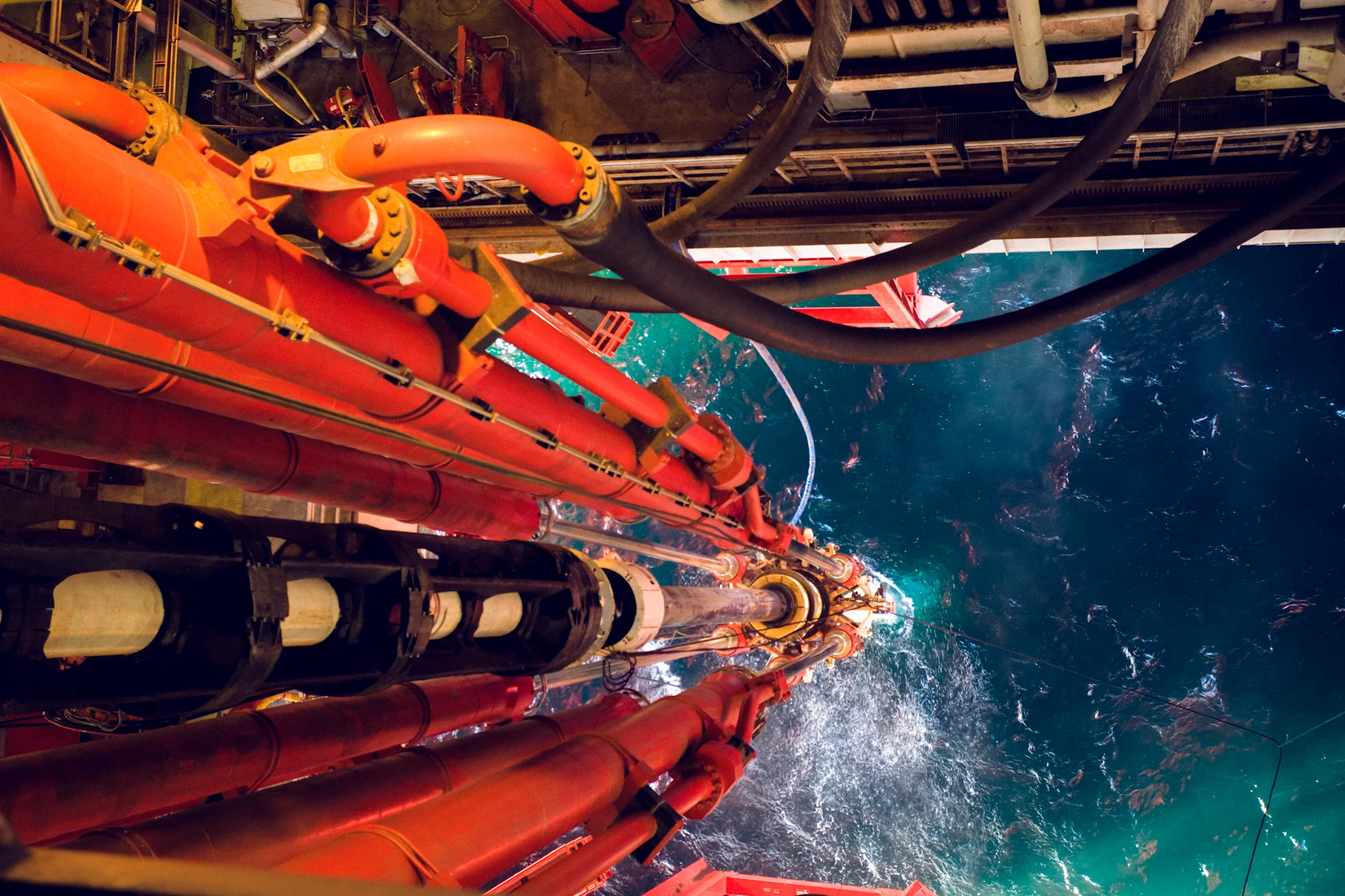 Oil rig view riser pipes down to sea level