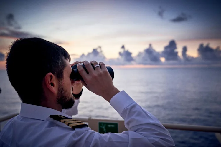 first-officer-looking-out-at-sea-min