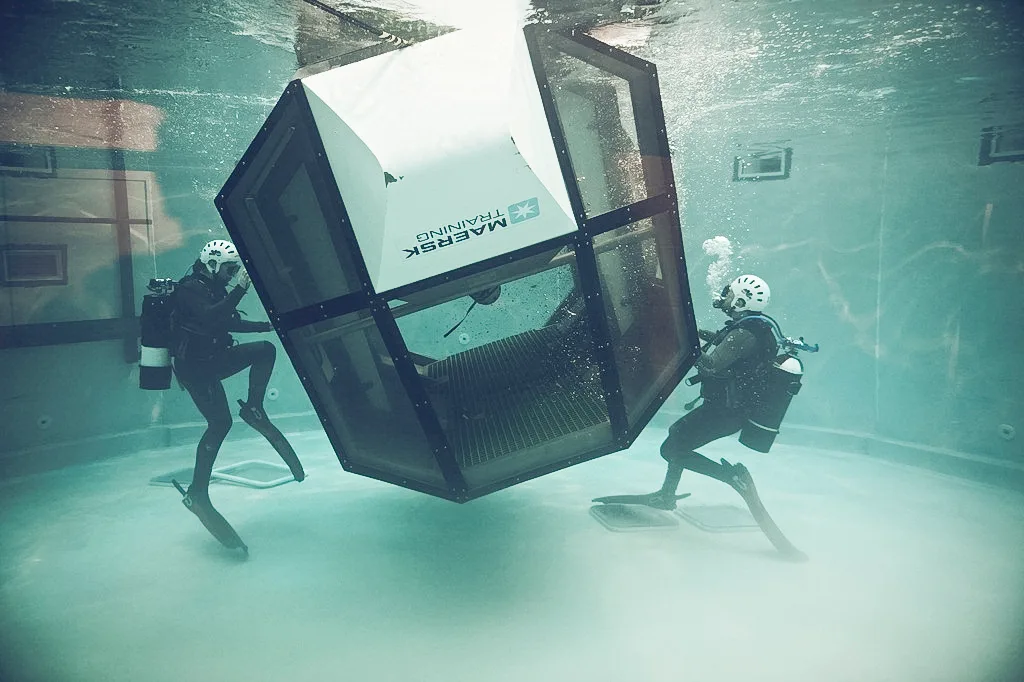 a Helicopter Underwater Escape Training (HUET) scenario, where trainees learn to handle emergency situations underwater