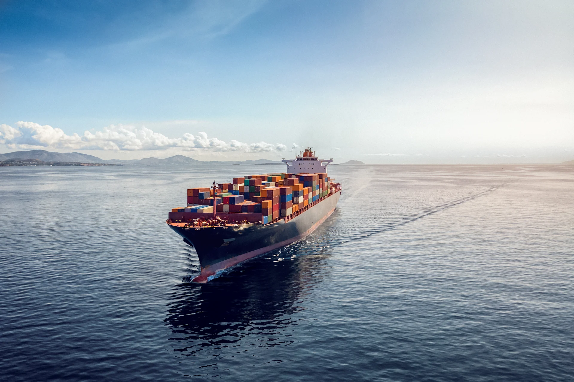 Aerial view of a heavy loaded container cargo vessel