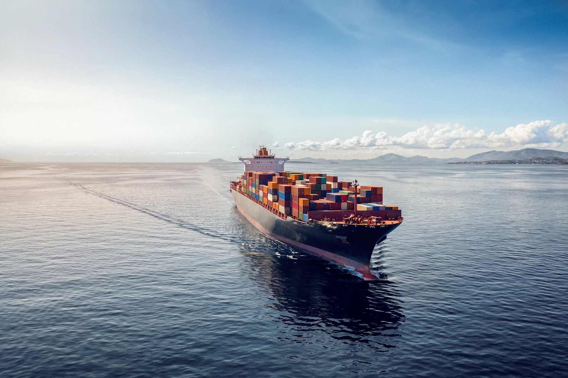 Aerial view of a heavy loaded container cargo vessel reversed