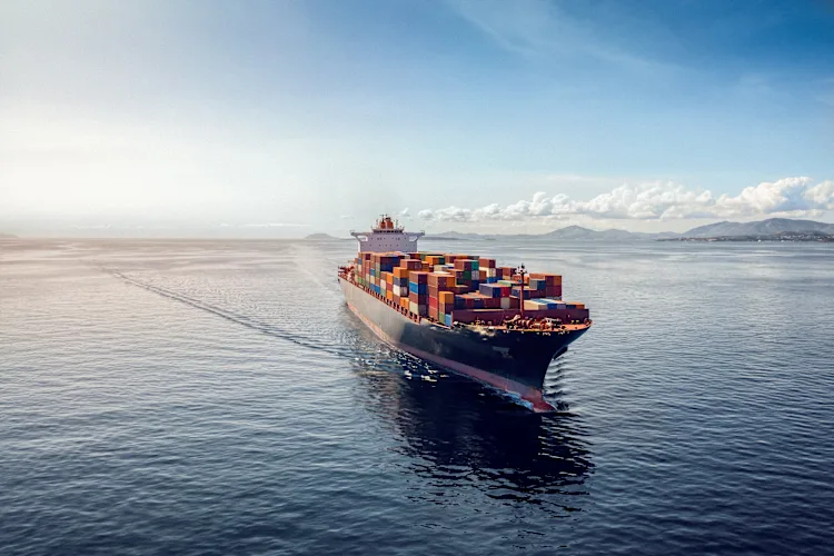 Aerial view of a heavy loaded container cargo vessel reversed