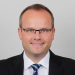 Portrait von Oliver Leitmann mit dunklem Jackett