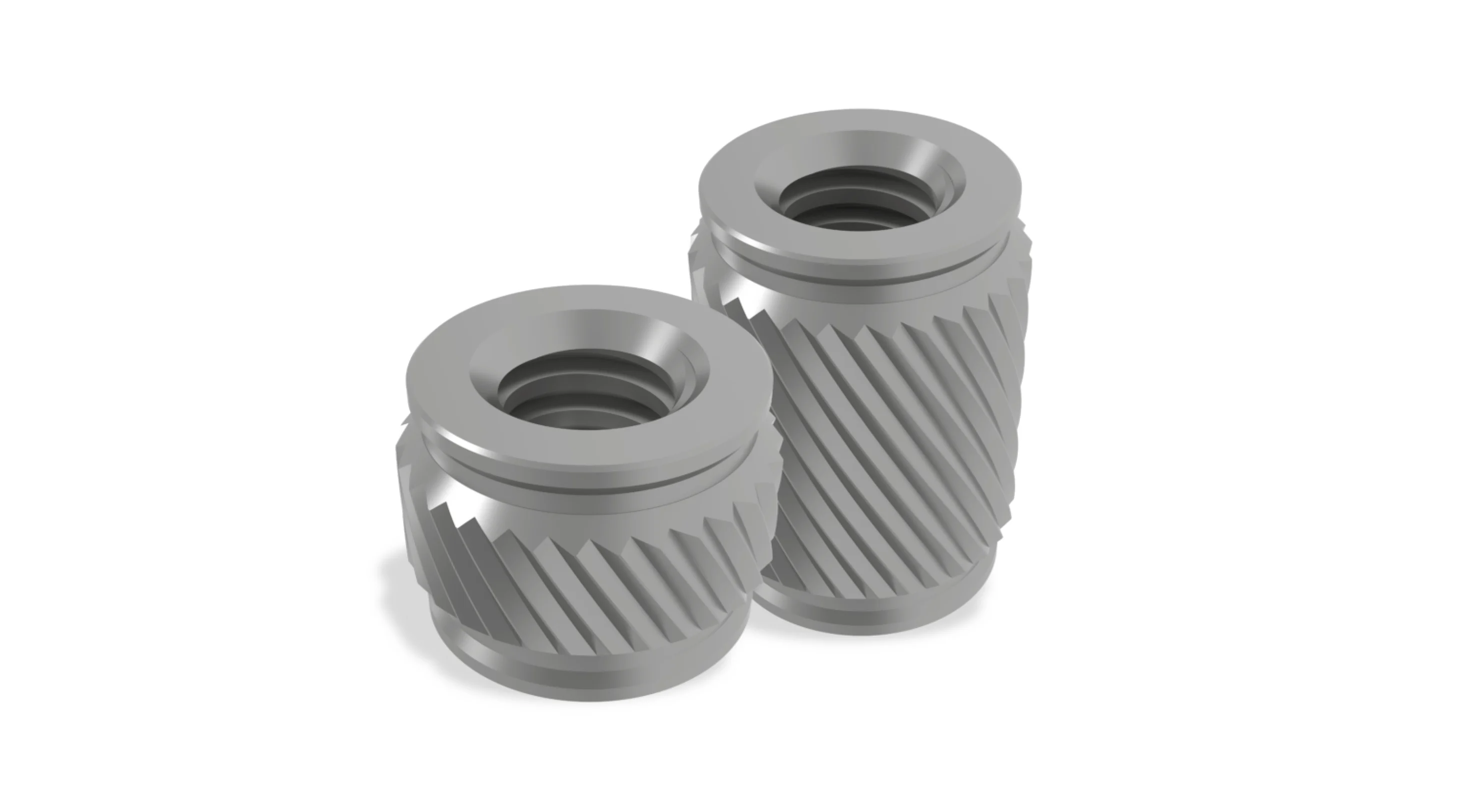 Two PEM CastSert press-in threaded inserts on white background