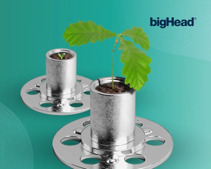 bigHead Befestigungselemente mit kleinen Pflanzen darin, als Symbol für Nachhaltigkeit.