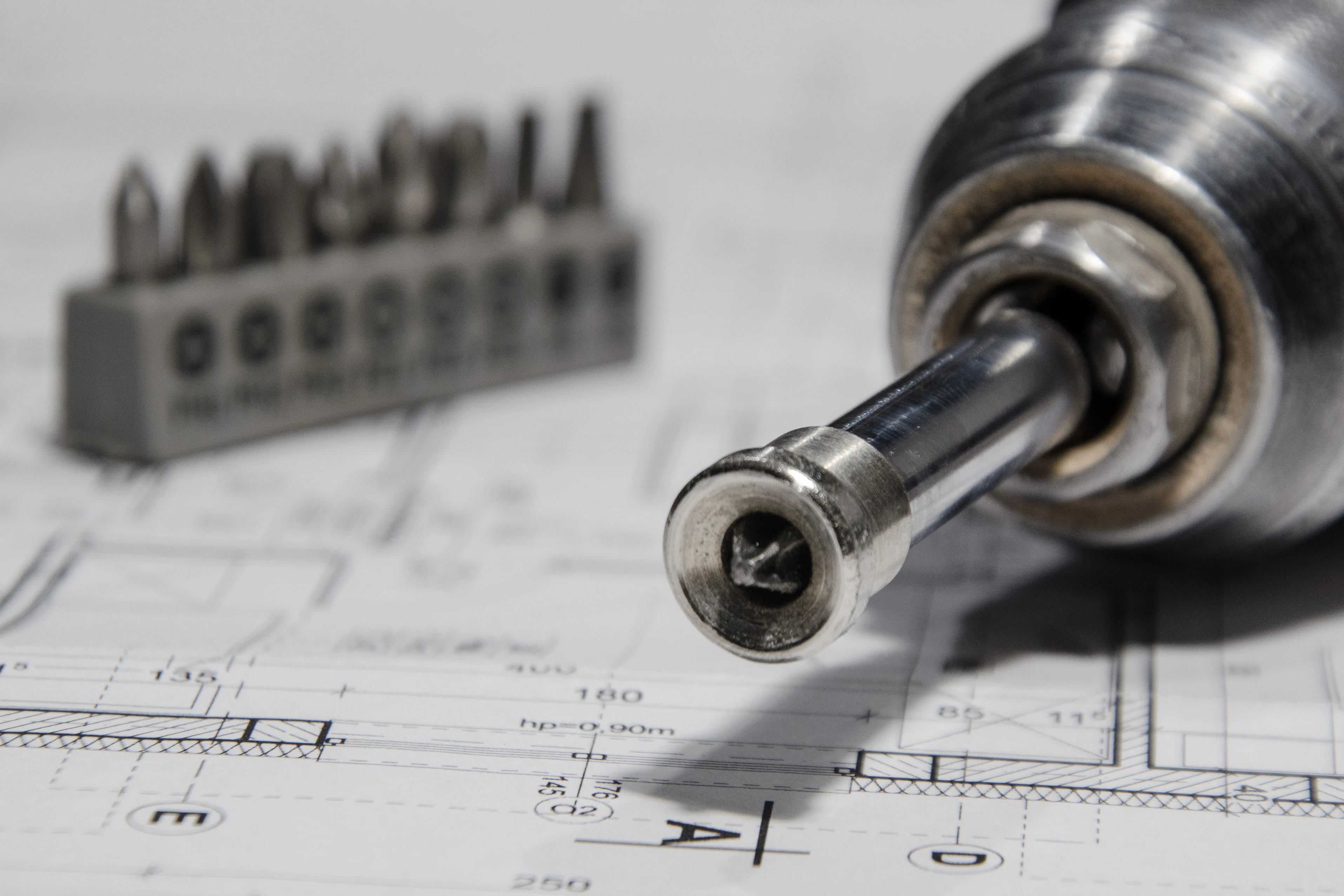 the tip of a hand tool on a technical drawing