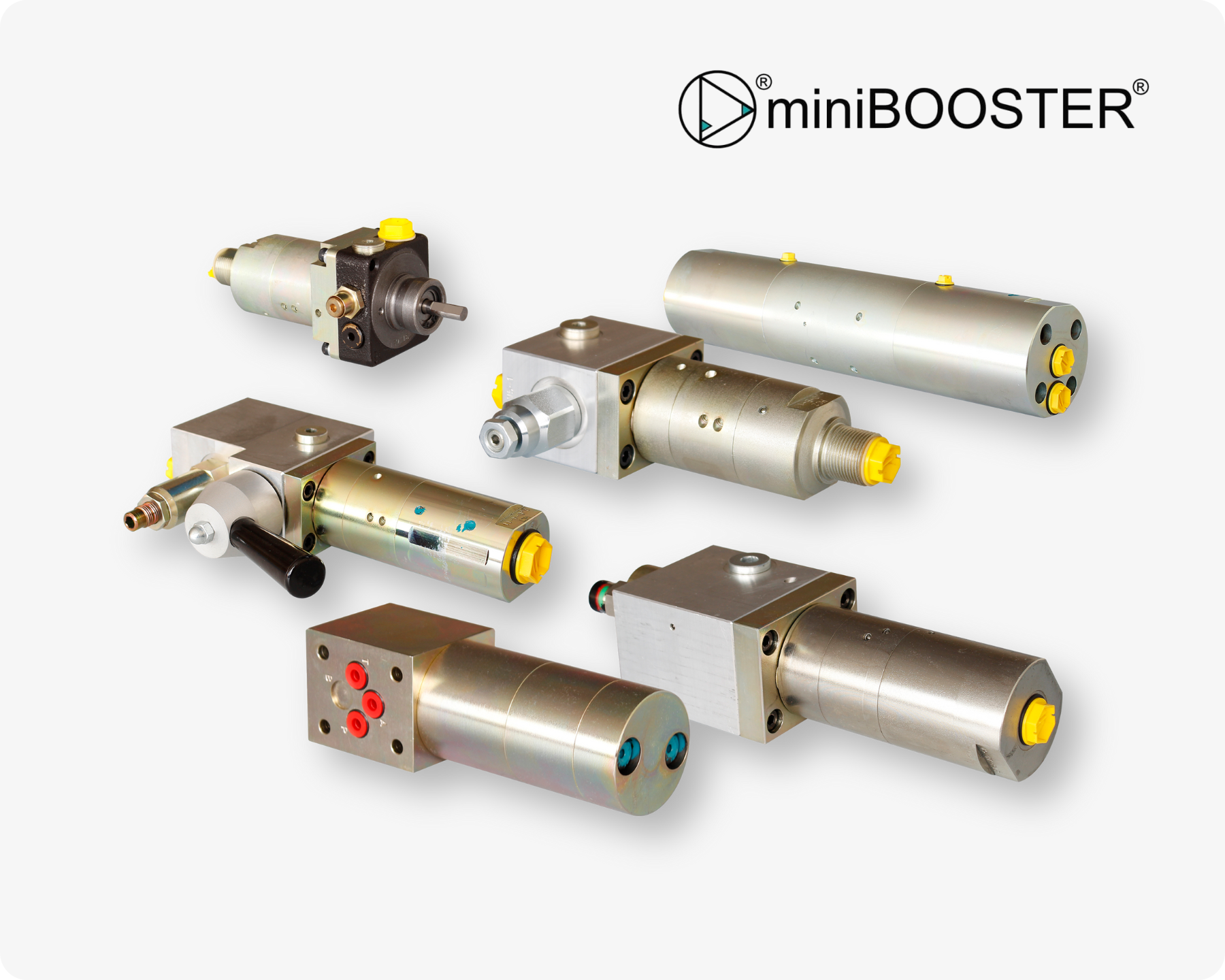 A variety of different miniBOOSTER® pressure intensifiers used to amplify a low inlet pressure to a high outlet pressure on light grey background.