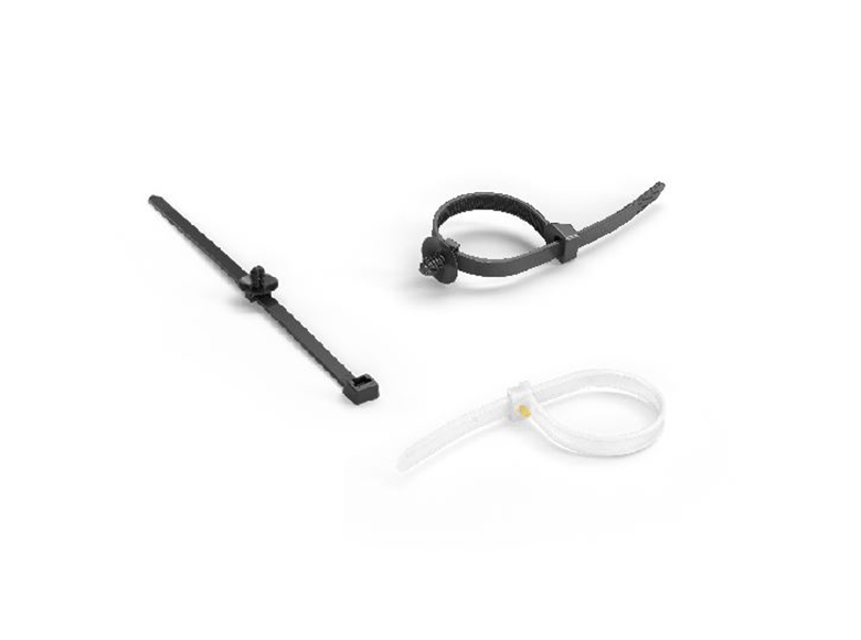 Two black and one white cable tie on white background