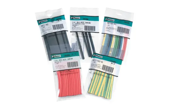 Five different packages of Panduit heat shrink tubes in different colors and sizes on white background