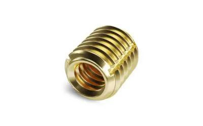 A brass Tappex Trisert threaded insert on white background