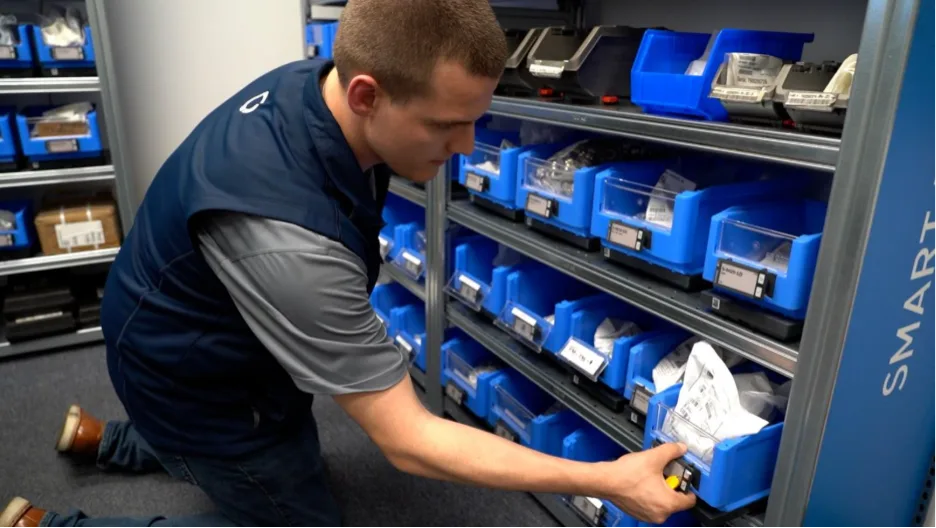 Bossard Smart Factory Logistics Specialist restocking and maintaining SmartBins