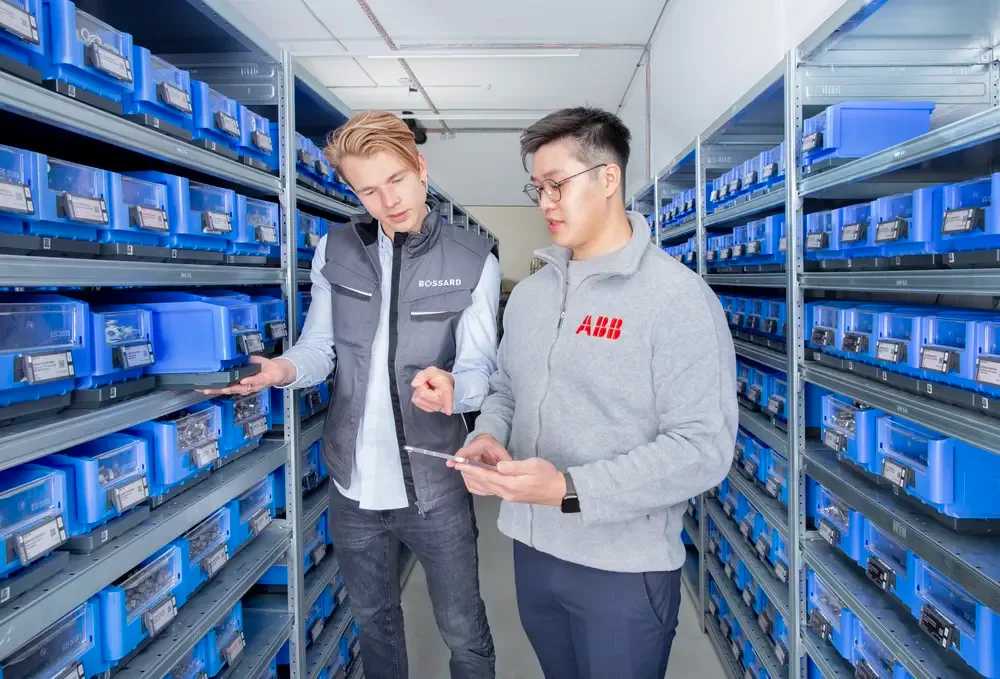 Person on shop floor is checking inventory list on a mobile device