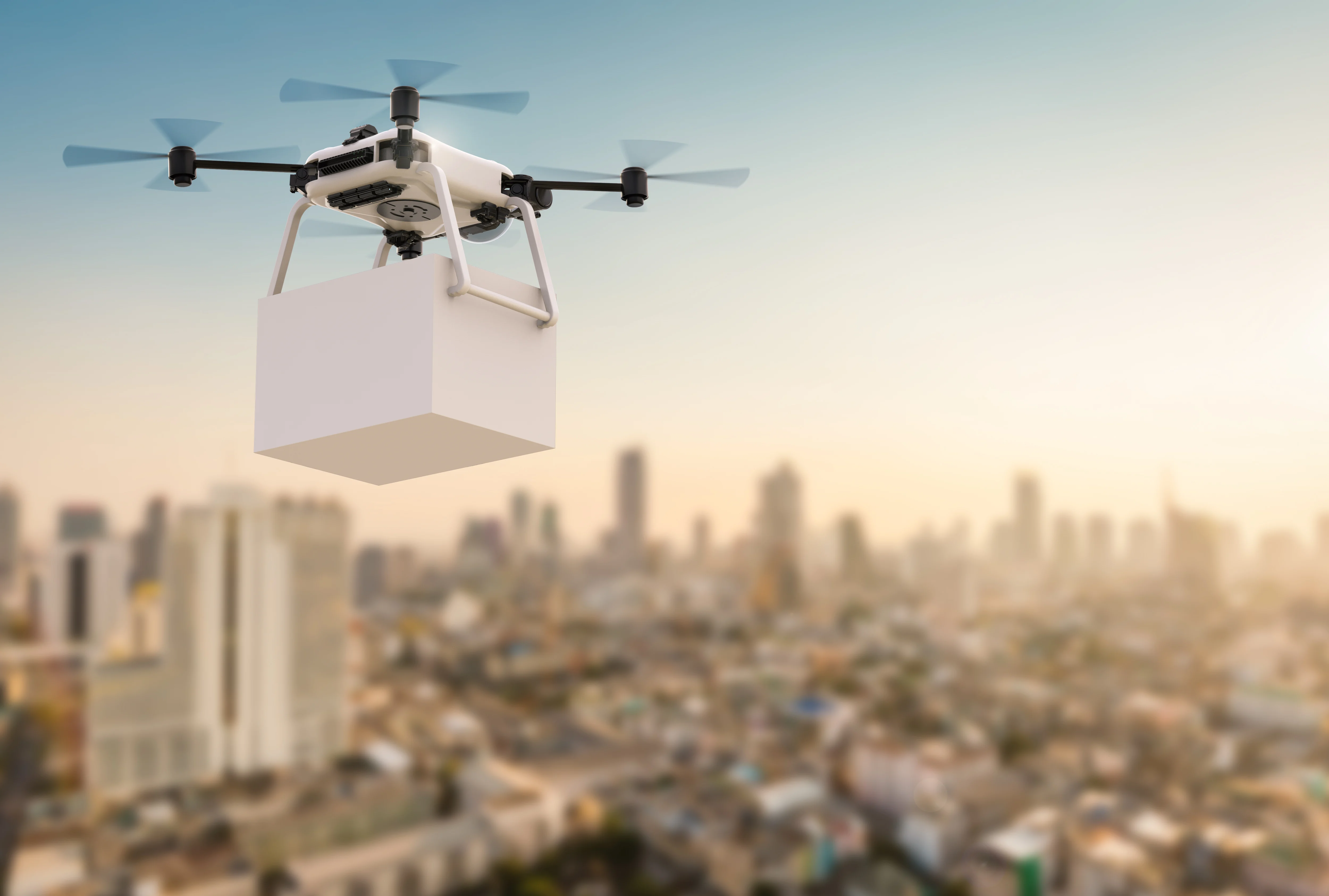 A futuristic drone soaring above a cityscape, symbolizing the advancement of drone delivery technology.