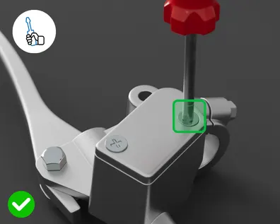 Gray mechanical device with red knob on top and green square button, demonstrating correct tool usage as measured by the Bossard SmartCamera.
