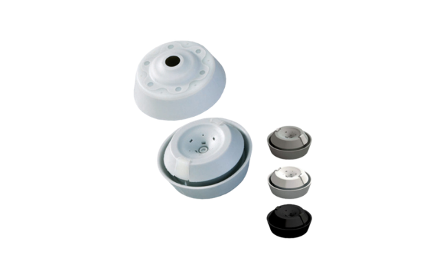 A close-up of several Jacob Klikseal sealing grommets in different colors on white background.