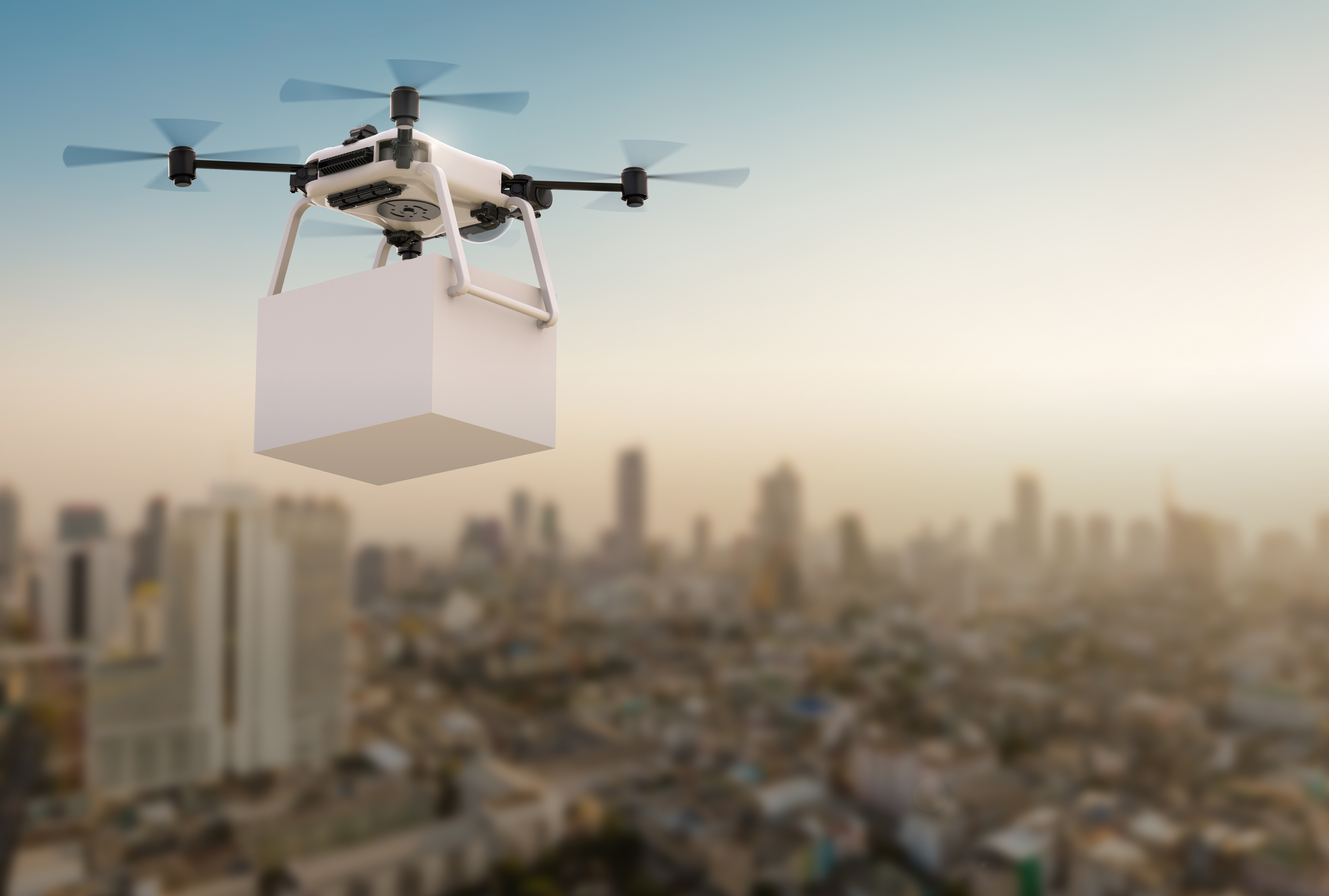 
Futuristický dron vznášející se nad městskou krajinou, symbolizující pokrok v technologii doručování drony.