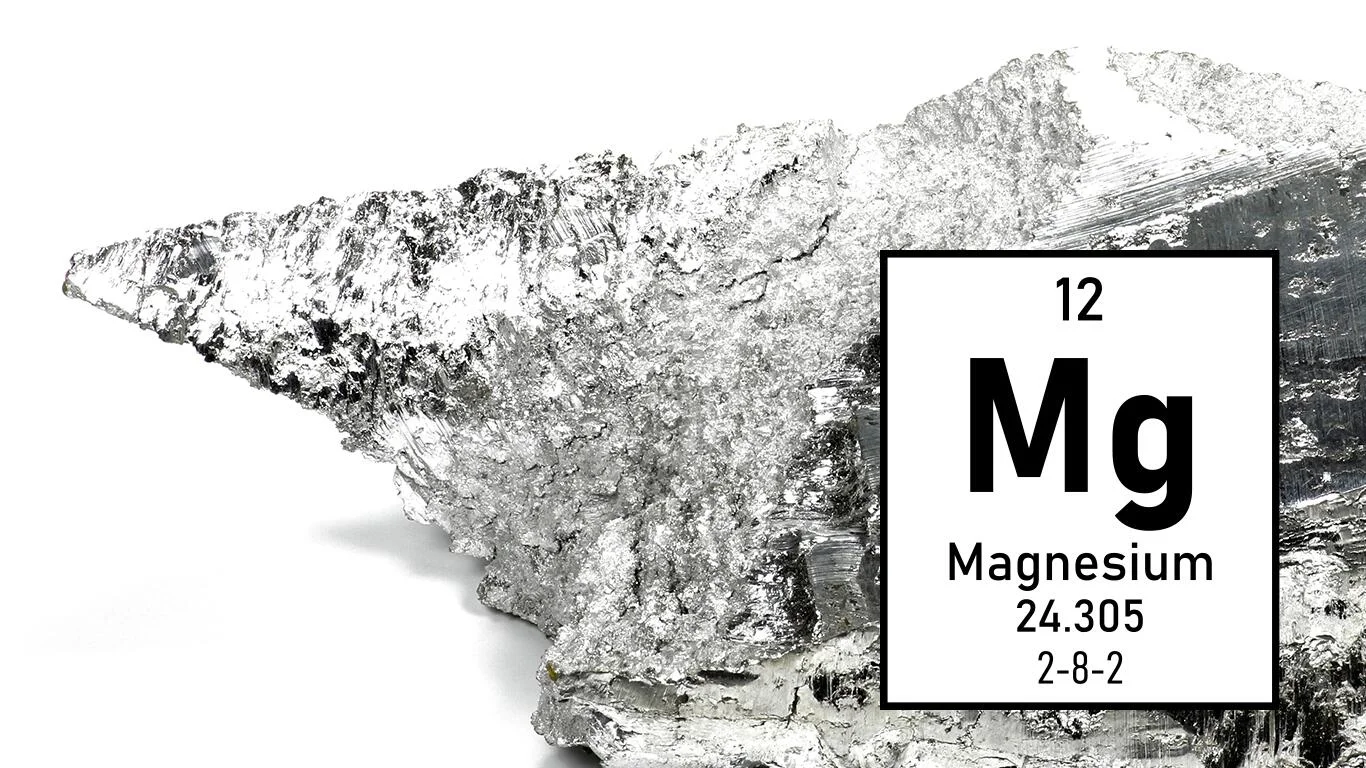 Silverly-white elemental magnesium with data from the periodic table. Image used for spectral analysis.