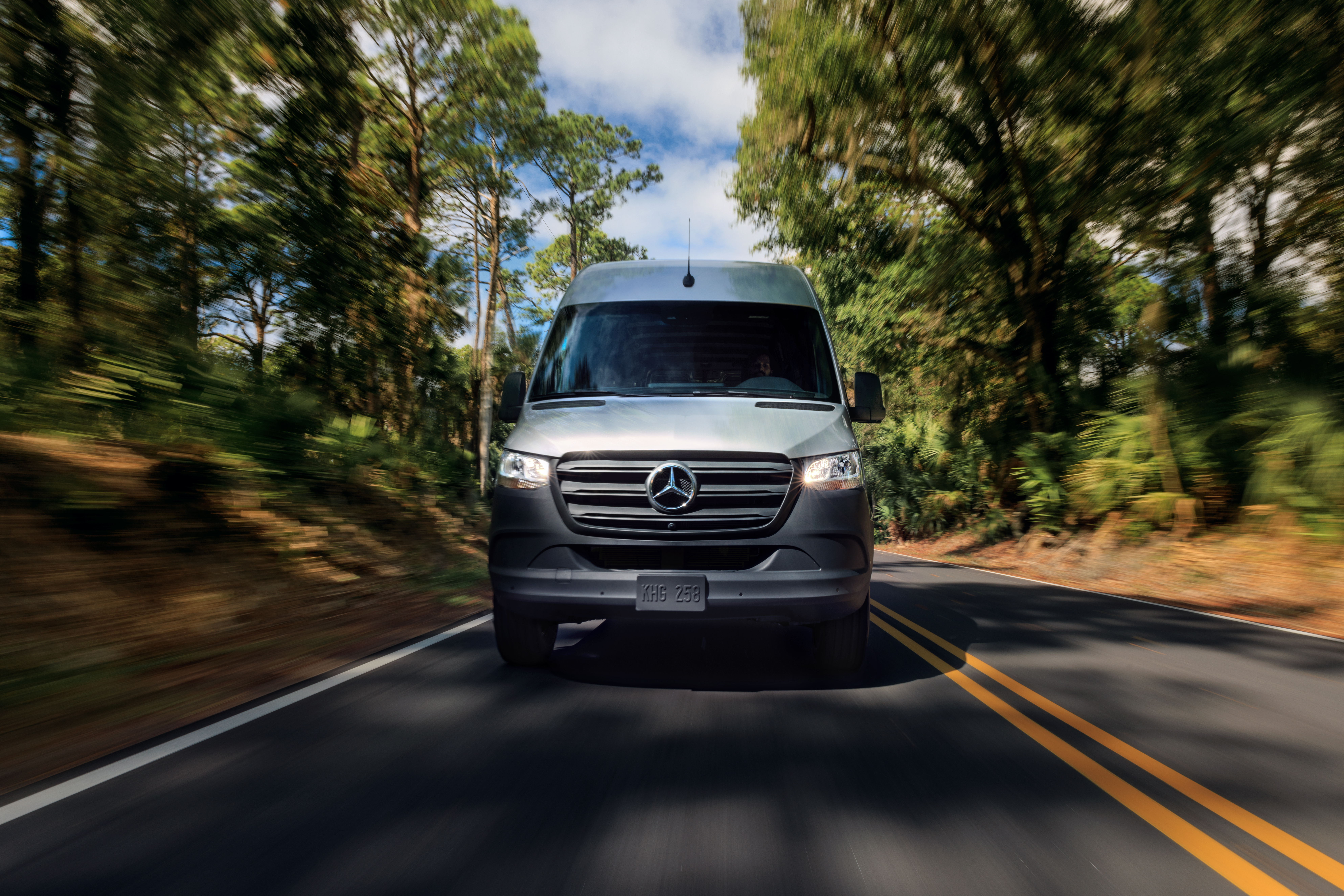 Woman in van checking navigation before long road trip.