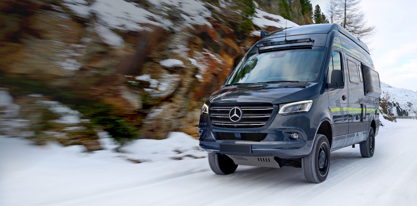 3 Mercedes Benz models on a snowcapped mountain