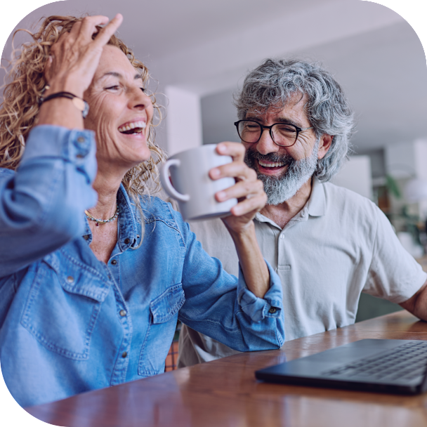 man-and-woman-smiling-laptop