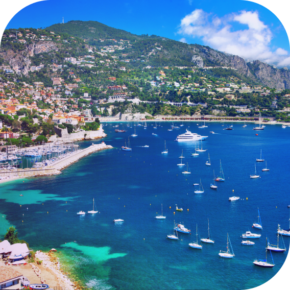 med shoreline with boat flotilla