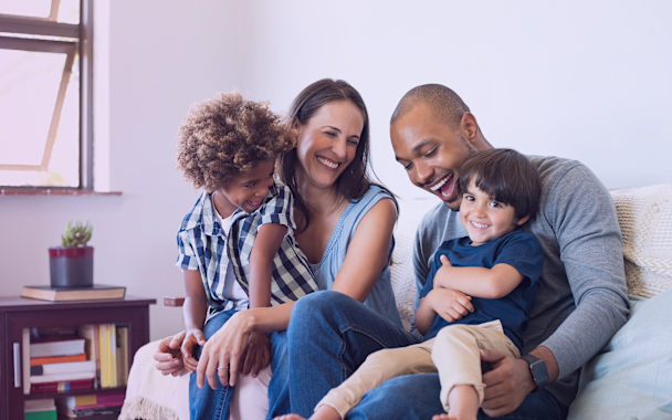 Family sitting on sofa